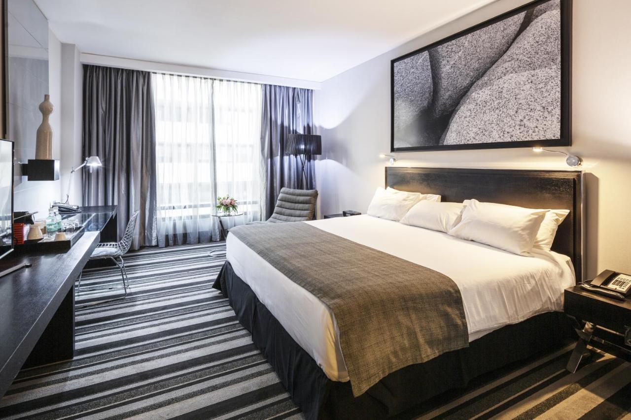 Отель Wyndham Santiago Pettra Экстерьер фото A room at the hotel