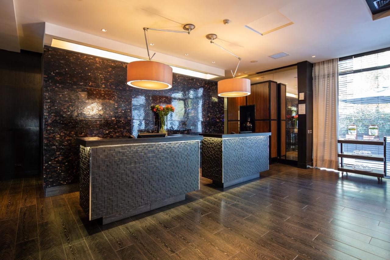 Отель Wyndham Santiago Pettra Экстерьер фото The hotel's lobby