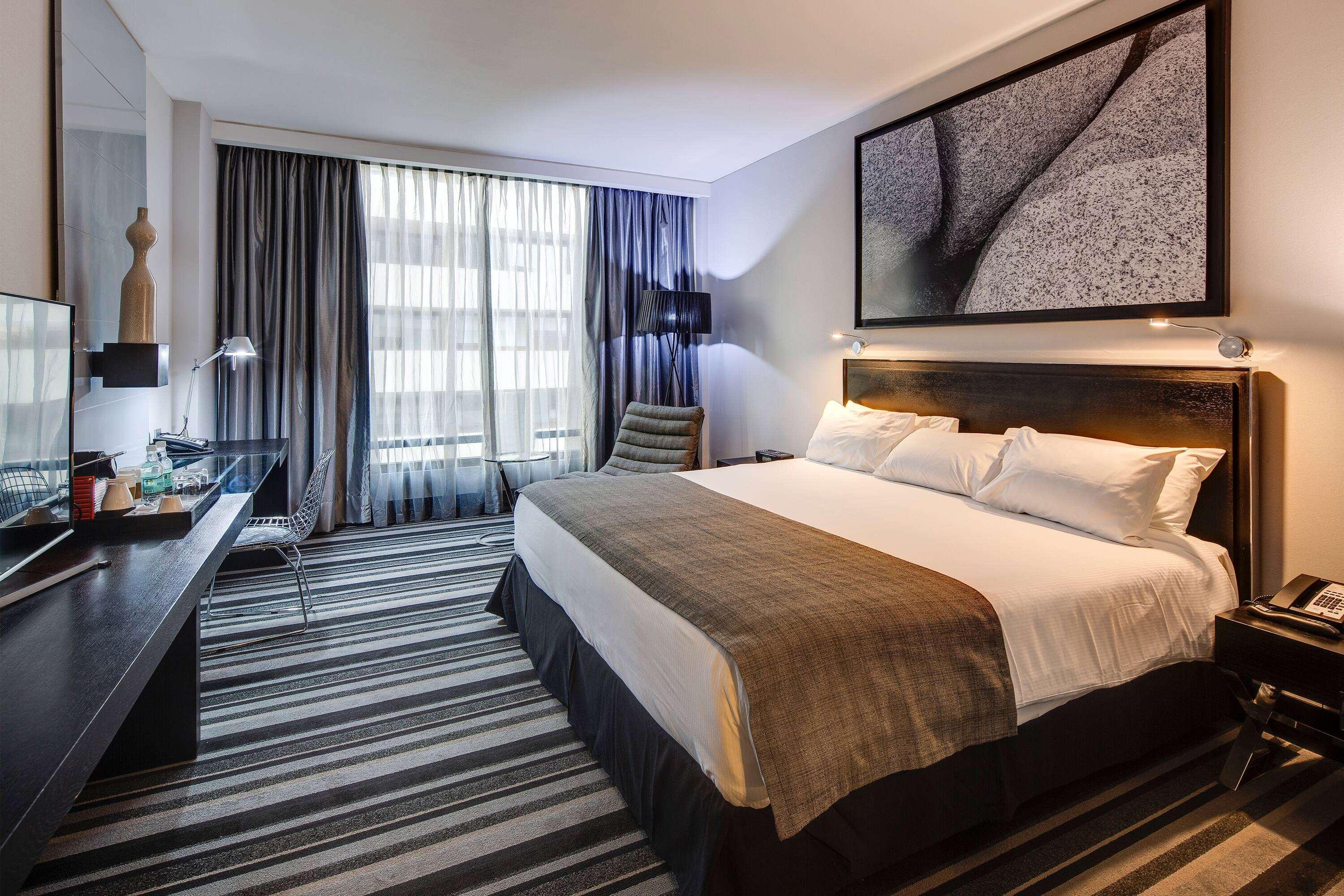 Отель Wyndham Santiago Pettra Экстерьер фото A room at the hotel