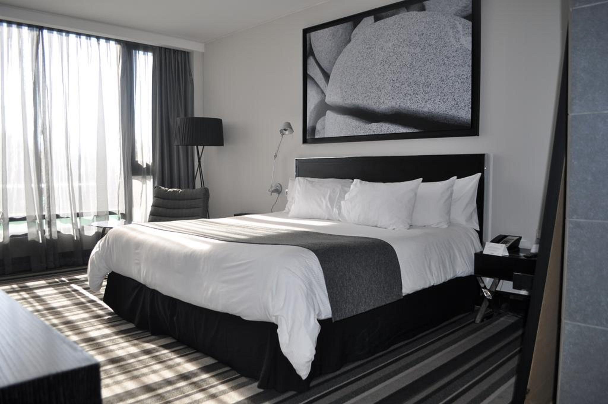 Отель Wyndham Santiago Pettra Экстерьер фото A bedroom