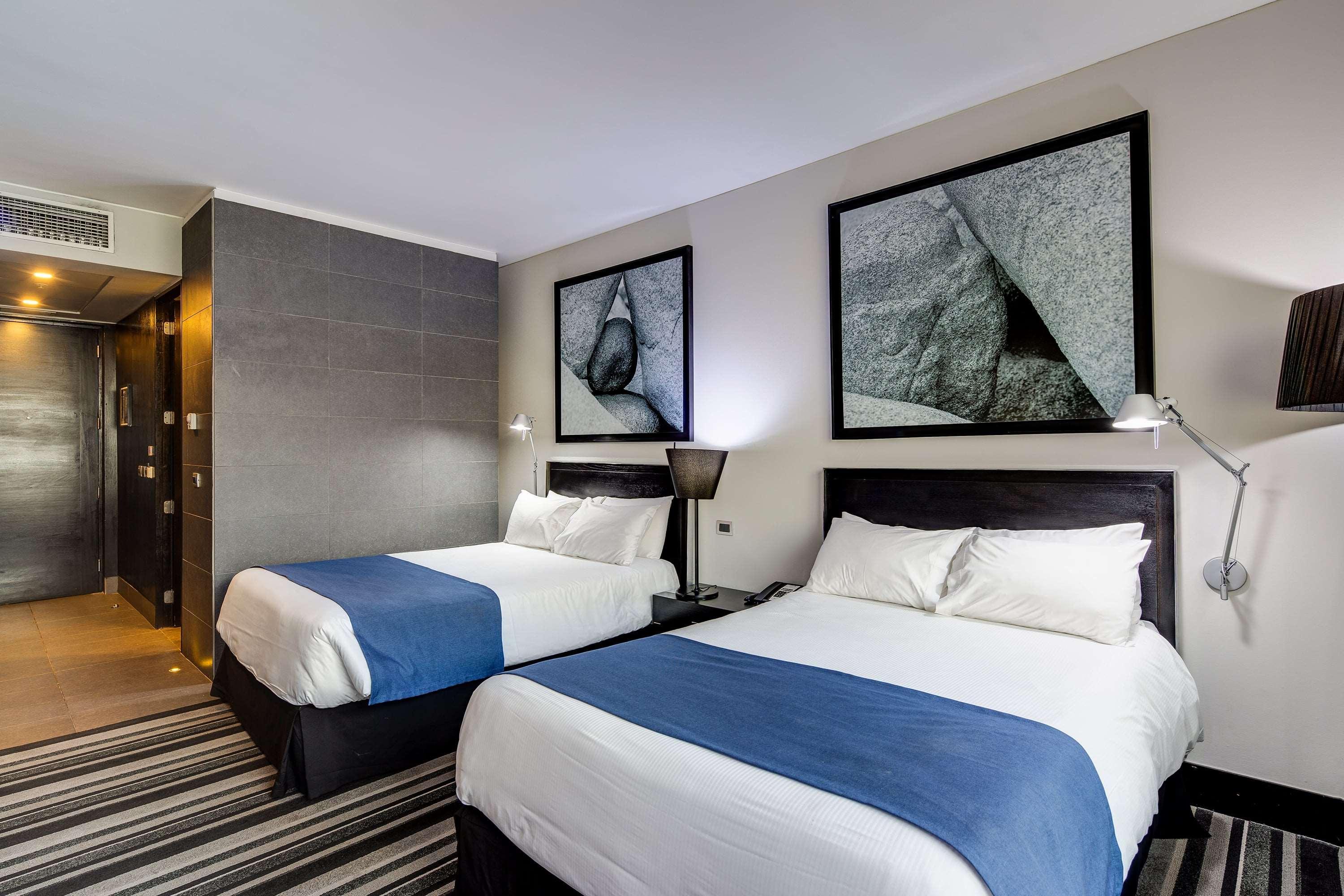 Отель Wyndham Santiago Pettra Экстерьер фото A room at the hotel